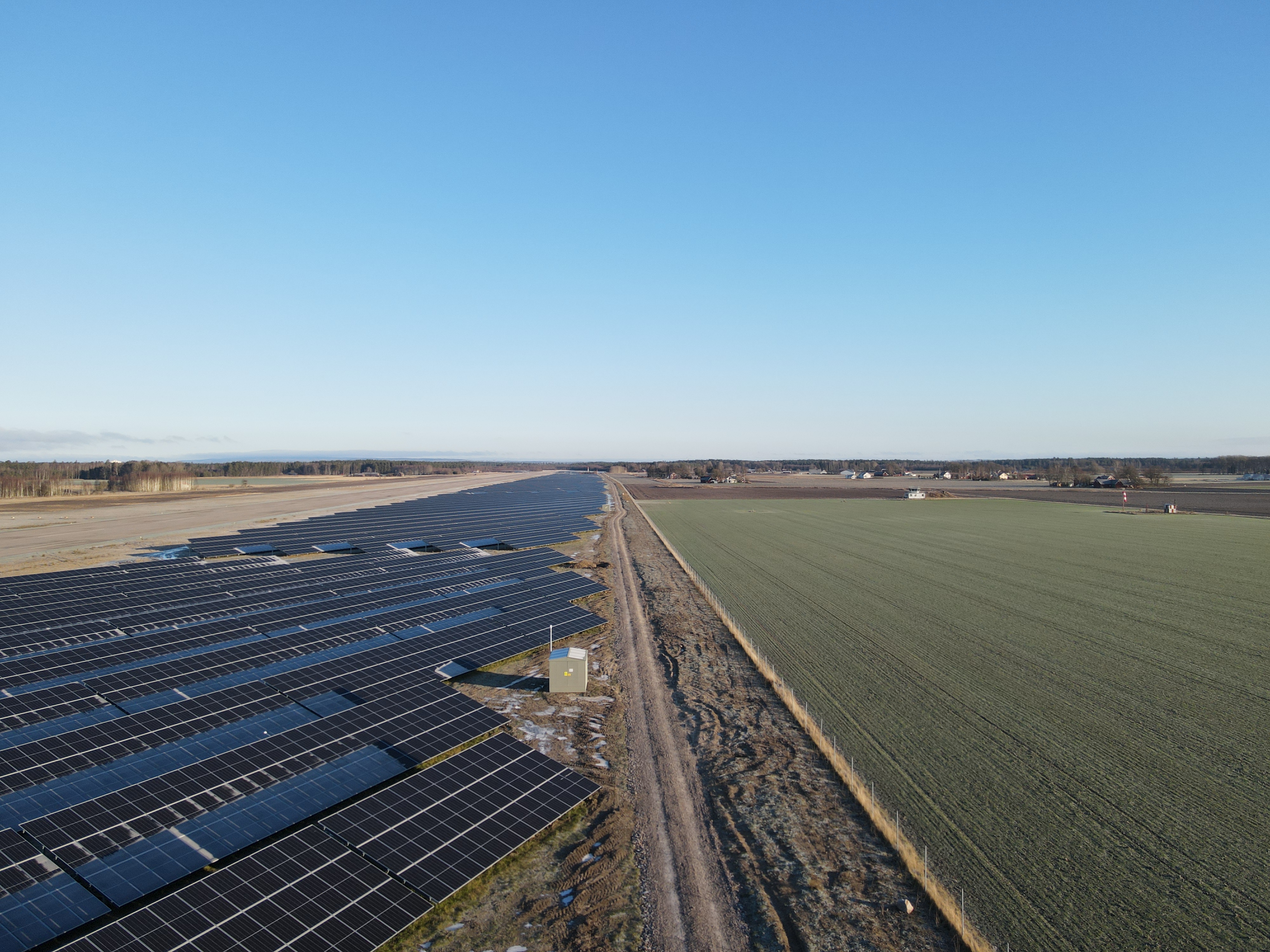 A birdseye view of a long solar park